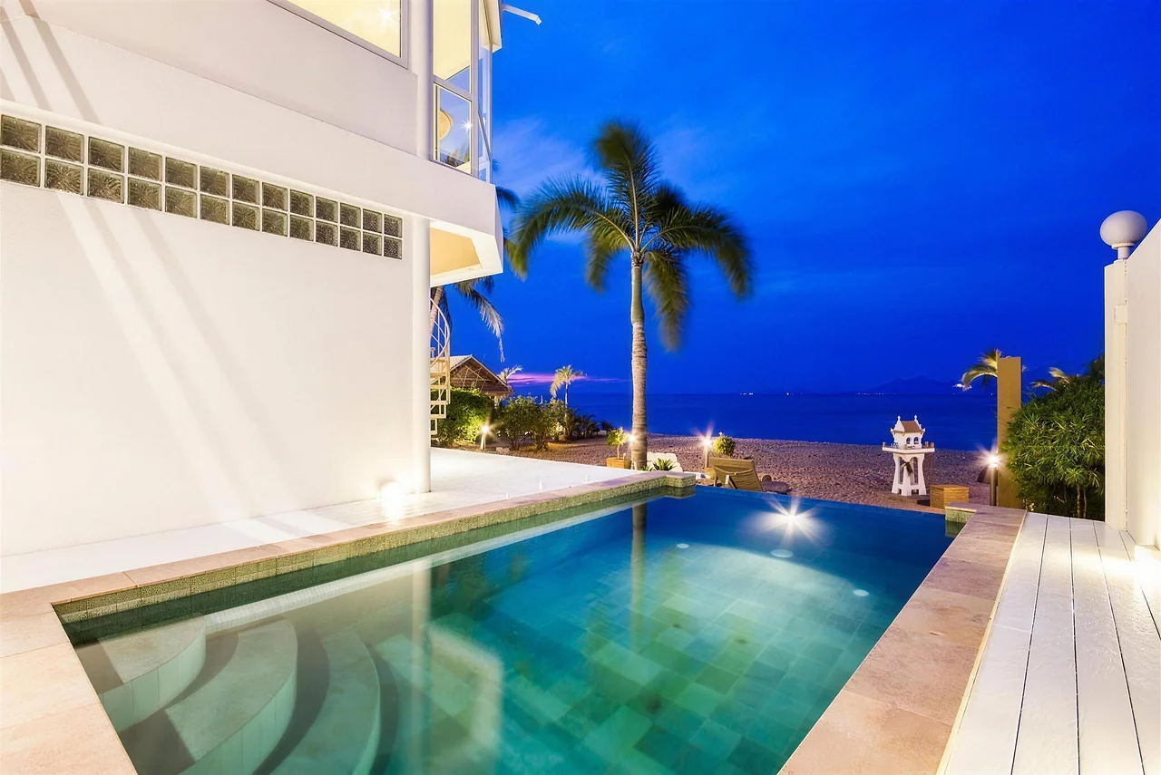 The pool and the beach at B1 lit at blue hour